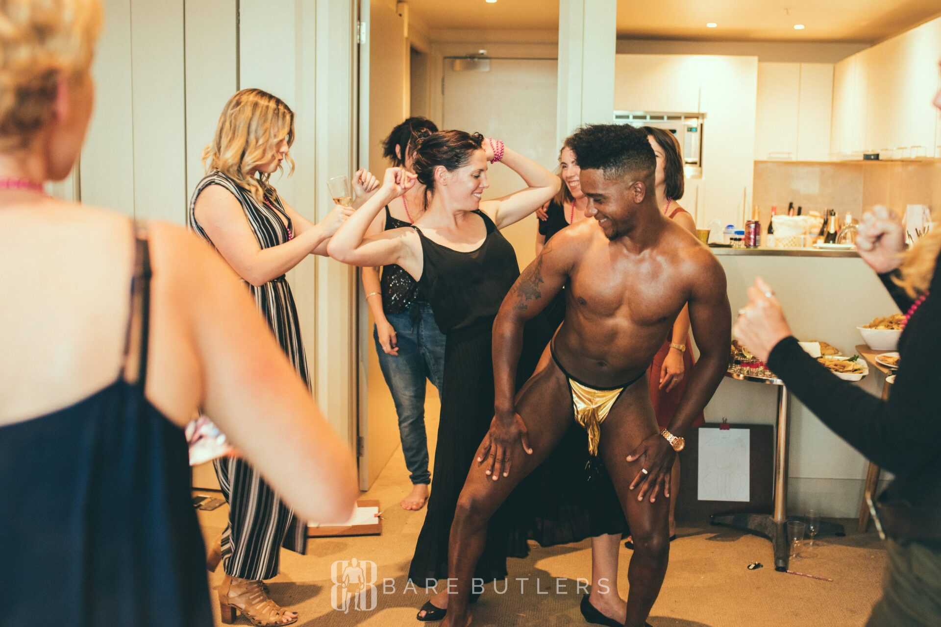 Wellington male stripper dances with Hen party guests, having lots of fun